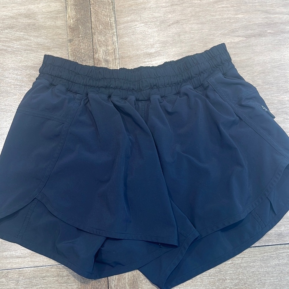Black lululemon tracker 4 shorts.